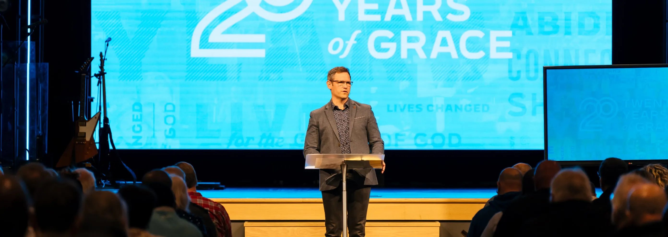 A pastor teaching from behind a podium